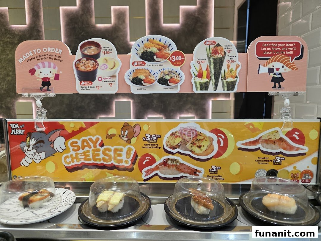 A vibrant display of sushi and other dishes on a conveyor belt with menu signs.