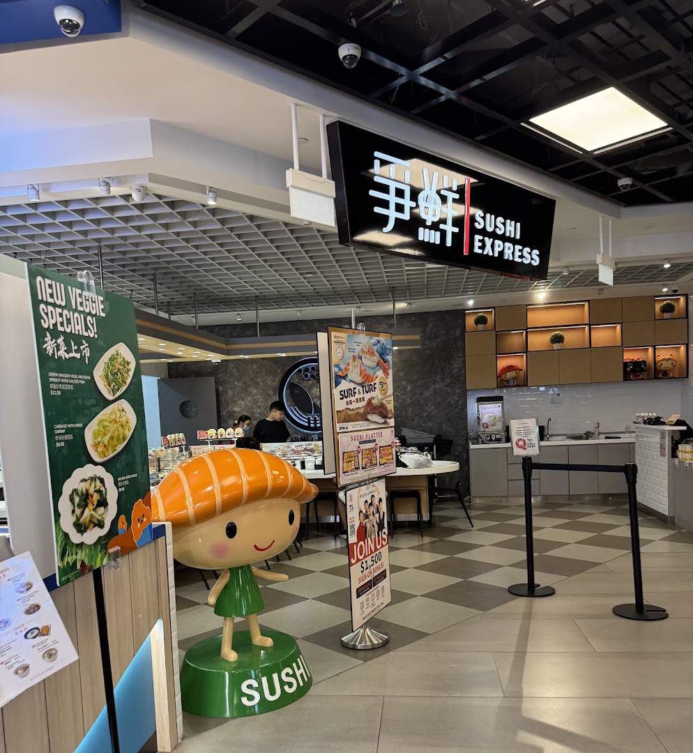 Interior view of Sushi Express, featuring a sushi mascot, promotional banners, and a clean counter area.