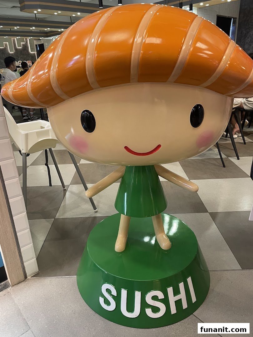 A large, friendly sushi mascot statue welcomes visitors to Sushi Express.