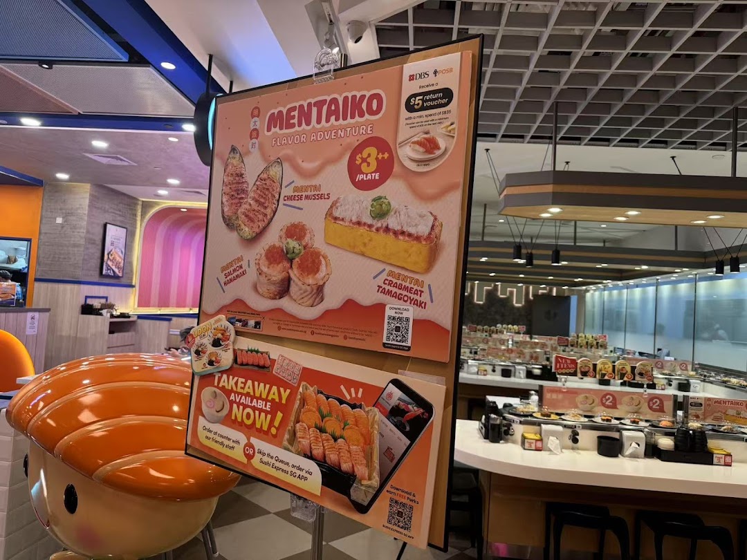 A promotional display board showcasing Mentaiko sushi specials and takeaway options inside Sushi Express.