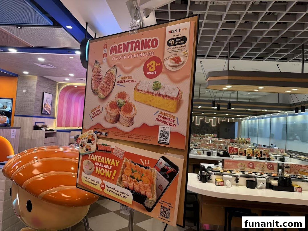 A promotional display board showcasing Mentaiko sushi specials and takeaway options inside Sushi Express.