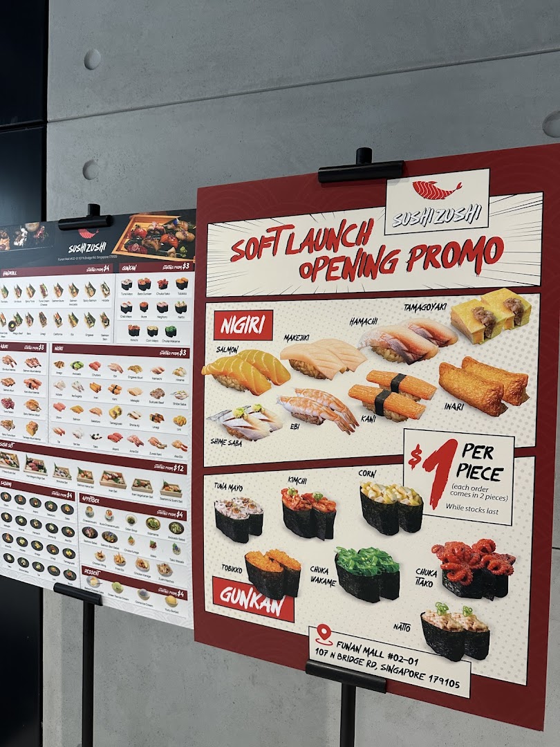 Two menu boards for Sushi Zushi, featuring a soft launch promo and main menu items.