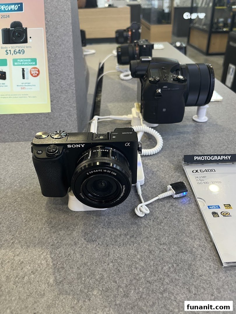 A display of Sony cameras, including the Alpha 6400, on a counter inside T K Foto Technic.
