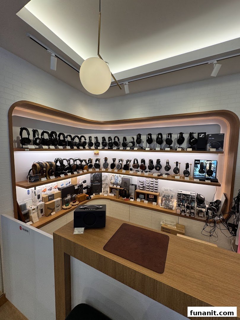 Interior view of T K Foto Technic Pte Ltd Funan, showcasing a wide array of headphones and audio equipment on display.
