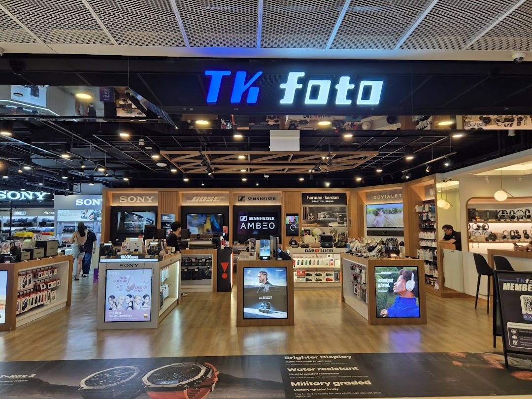 An interior view of TK Foto Technic, showcasing a wide range of cameras, audio equipment, and electronics.