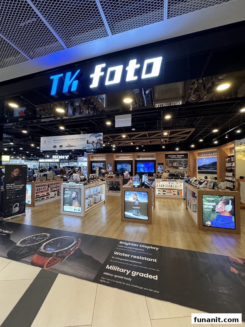 An interior view of TK Foto Technic, showcasing various electronics, cameras, and audio equipment displays.