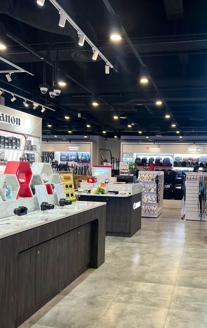 Interior view of T K Foto Technic, showcasing cameras, lenses, and photography accessories on display.