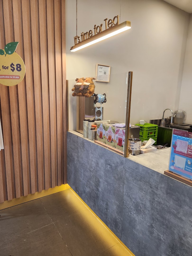 Interior view of The Alley's counter, featuring a 'It's time for Tea' sign and drink preparation area.