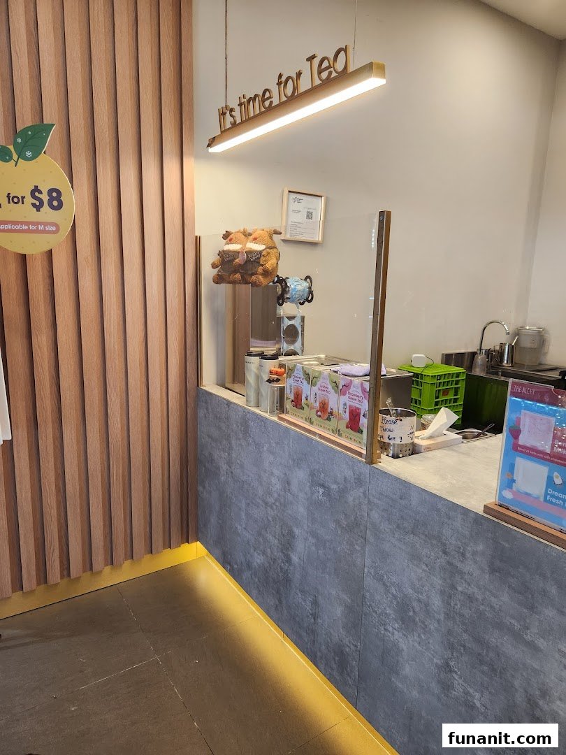 Interior view of The Alley's counter, featuring a 'It's time for Tea' sign and drink preparation area.