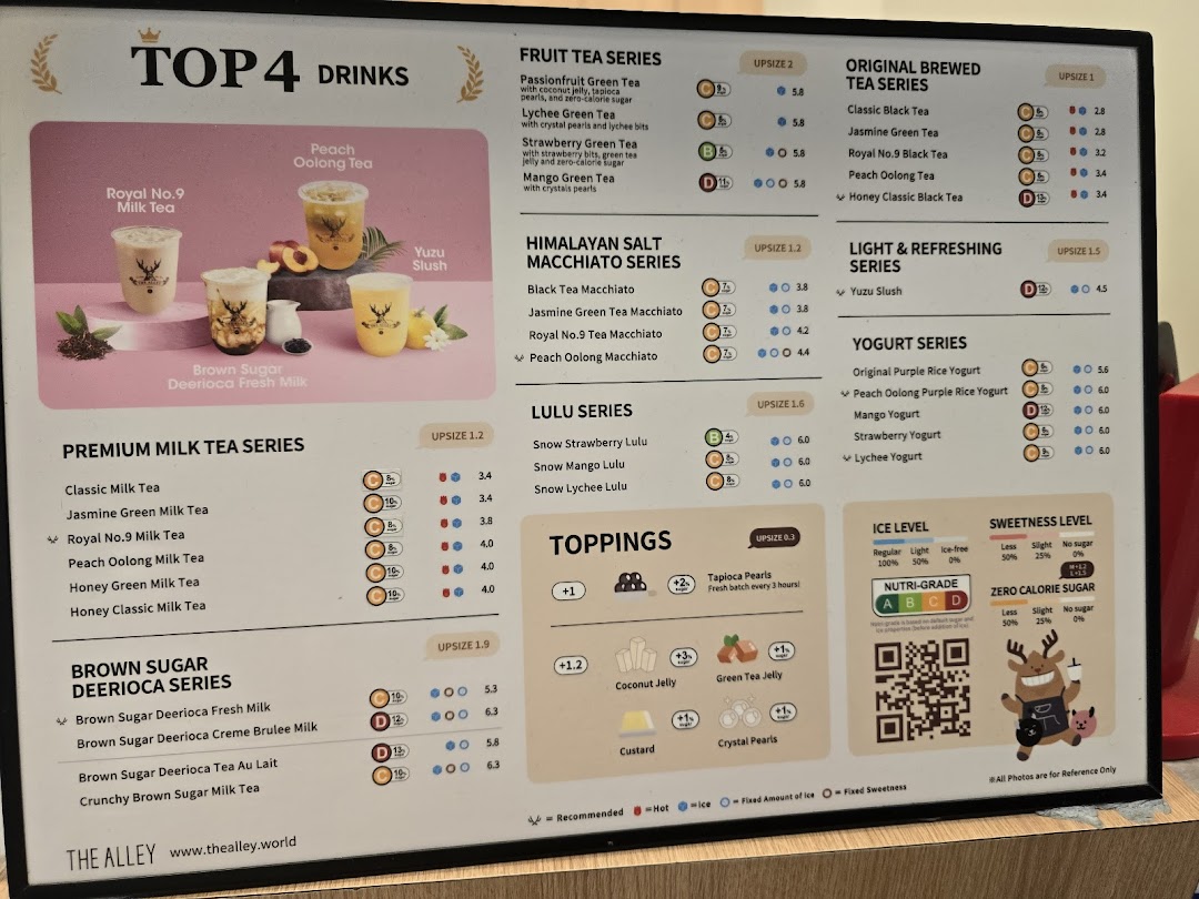 A detailed menu board for The Alley, showcasing various bubble tea drinks, toppings, and pricing.