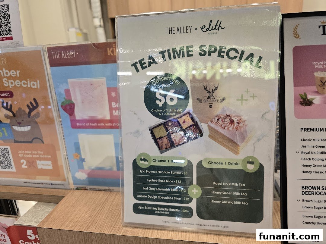 A display of promotional menus at The Alley, featuring a tea time special with drinks and desserts.