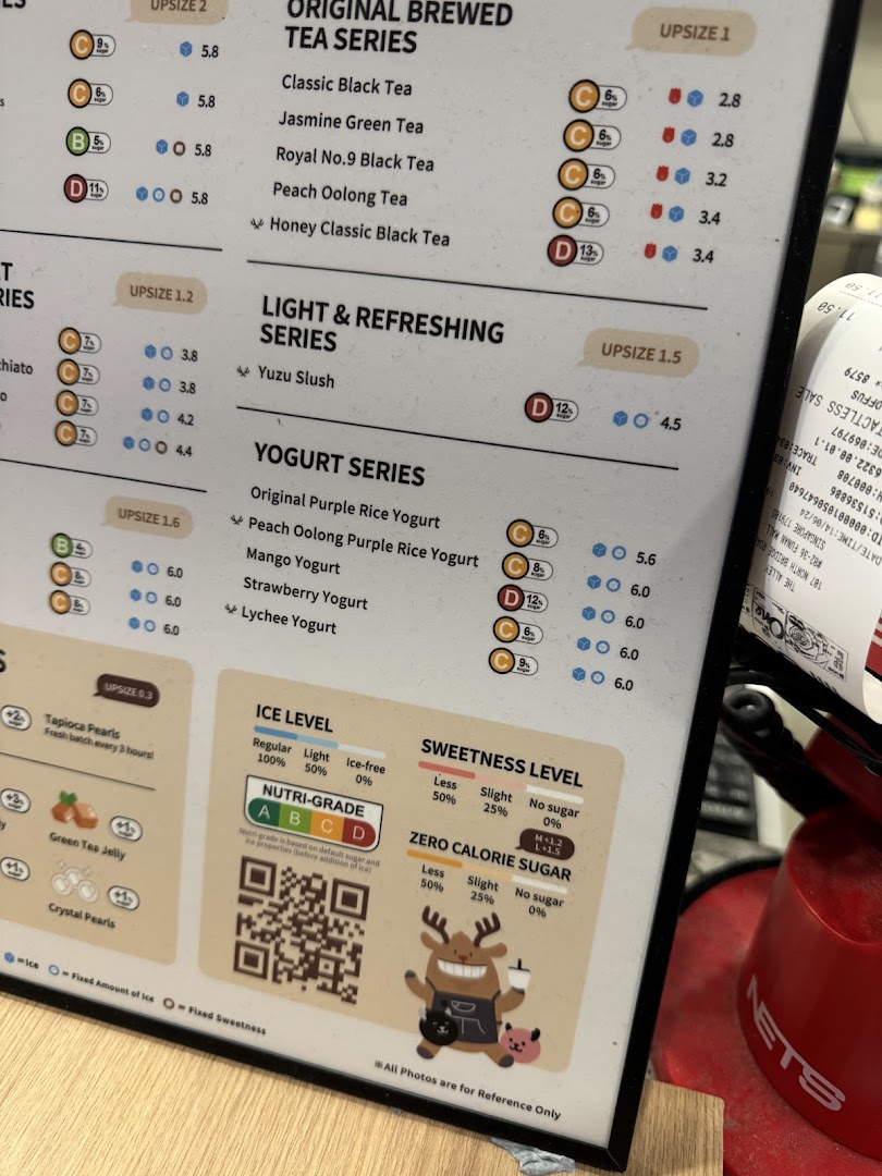 A detailed menu board for The Alley, featuring various tea and yogurt drinks with prices and customization options.