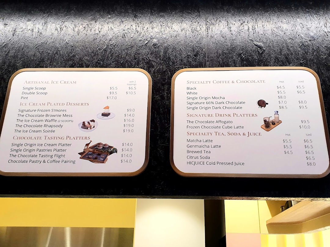 Two menu boards displaying artisanal ice cream, chocolate desserts, coffee, and specialty drinks.