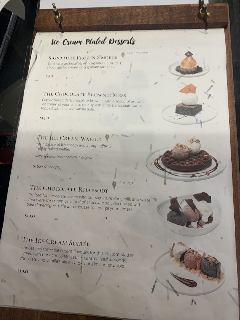 A menu displaying various ice cream plated desserts with descriptions and prices.