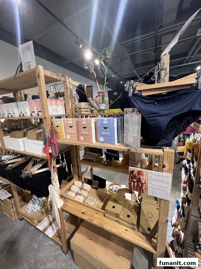 An interior shot of The Green Collective SG, showcasing sustainable period underwear and eco-friendly products on wooden shelves.