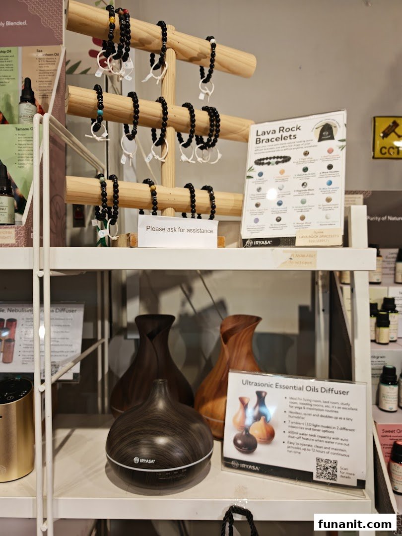 A retail display featuring lava rock bracelets and ultrasonic essential oil diffusers.