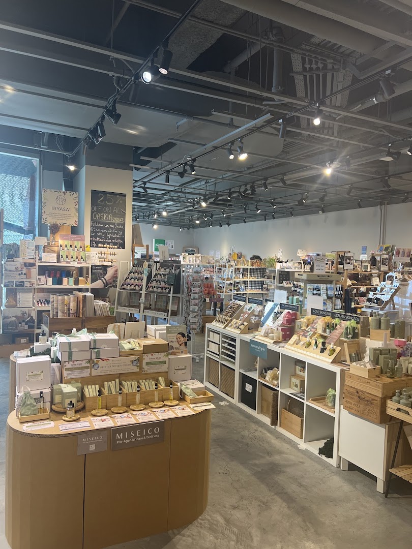 An interior view of The Green Collective SG, showcasing a wide array of natural skincare and wellness products on display.