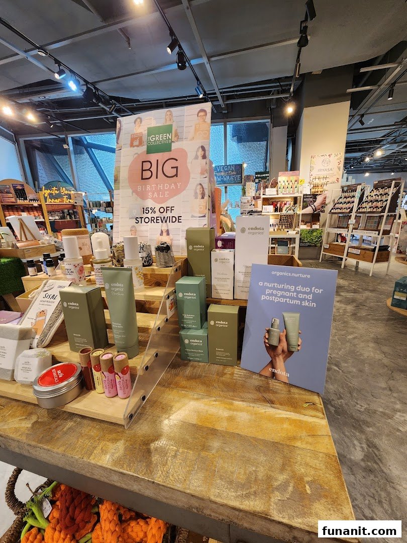 An in-store display at The Green Collective SG featuring organic beauty products and a 'Big Birthday Sale' sign.