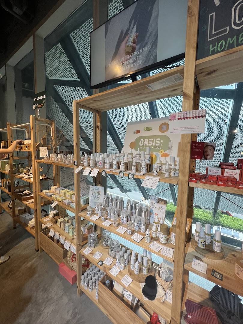 Interior view of a shop with wooden shelves displaying various wellness and beauty products.