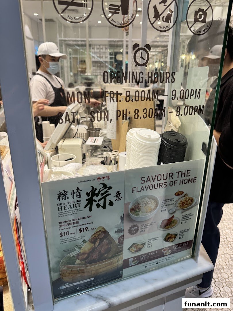 A Toast Box counter displaying opening hours, promotional food sets, and menu items with prices.
