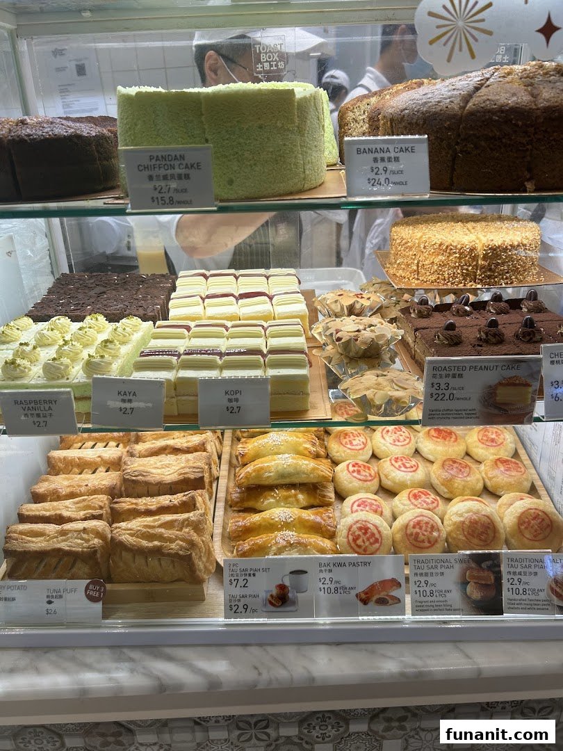 A vibrant display case showcasing a variety of freshly baked cakes, pastries, and traditional local delights.
