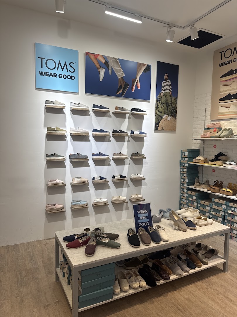 Interior view of TOMS Funan, showcasing a wide array of stylish and comfortable shoes on display.