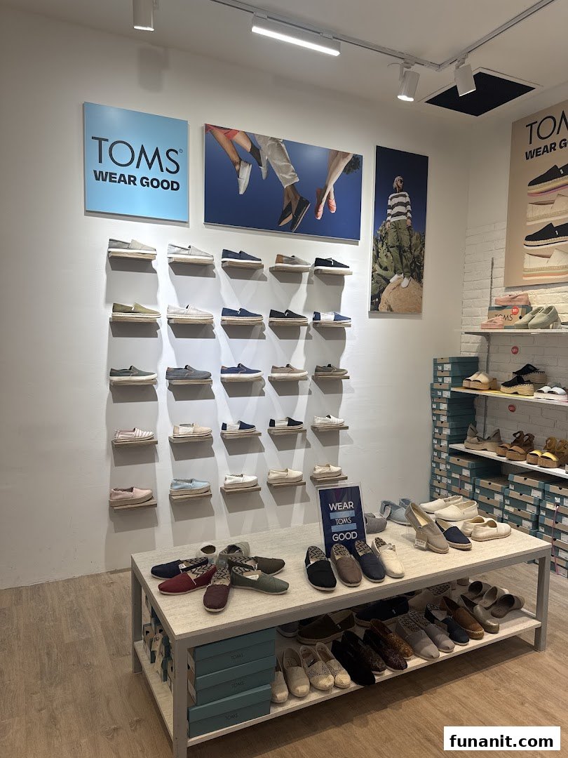 Interior view of TOMS Funan, showcasing a wide array of stylish and comfortable shoes on display.