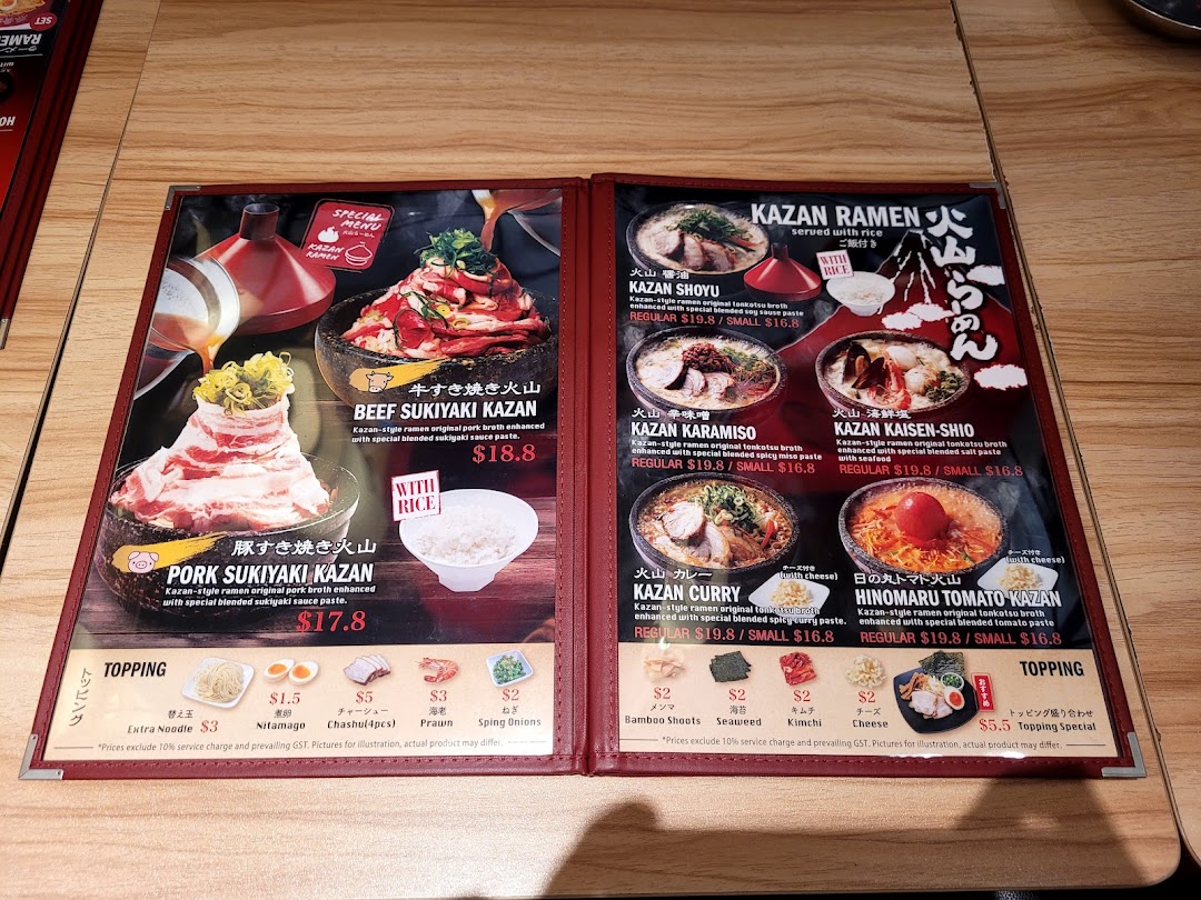 An open menu displaying various ramen and sukiyaki dishes with prices and topping options.