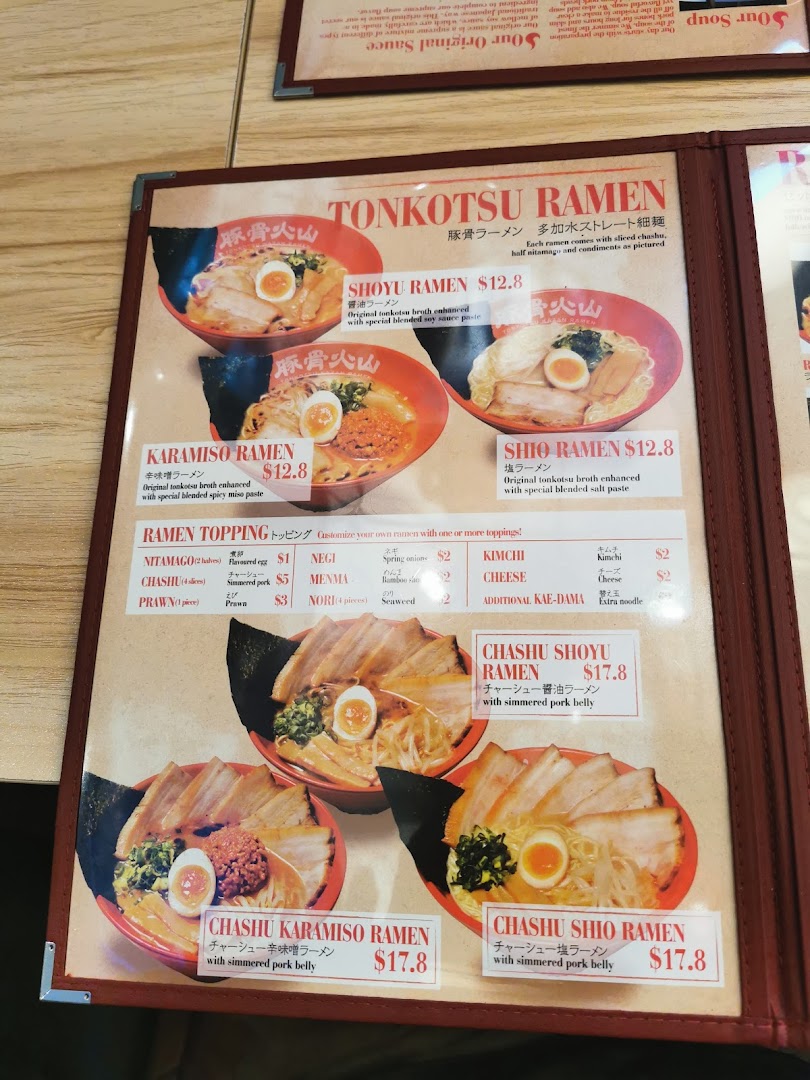 A detailed menu displaying various ramen types, toppings, and prices.