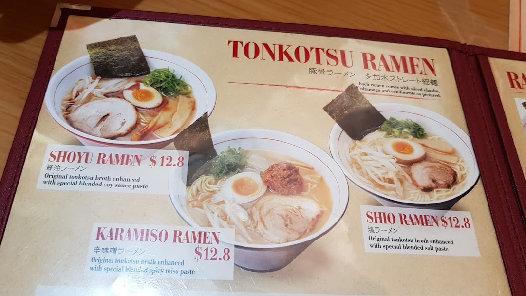 A close-up of a ramen menu displaying various Tonkotsu ramen options with prices.
