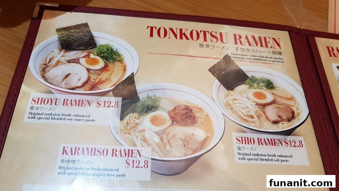 A close-up of a ramen menu displaying various Tonkotsu ramen options with prices.