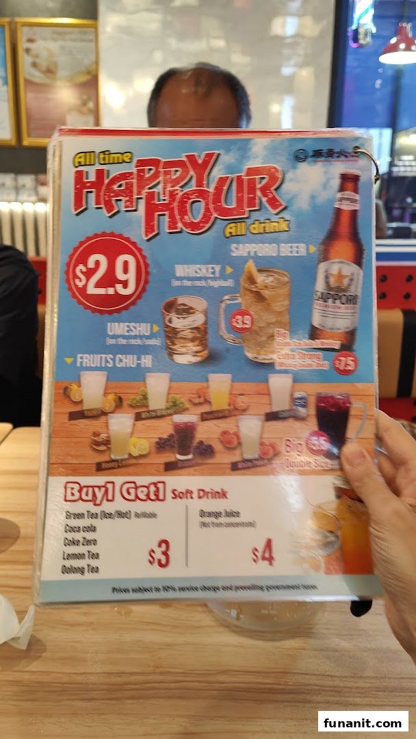 A close-up of a happy hour and soft drink menu from a ramen shop.