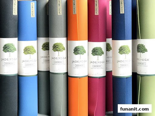 A vibrant display of colorful Jade Yoga Harmony mats, showcasing the shop's diverse product range.
