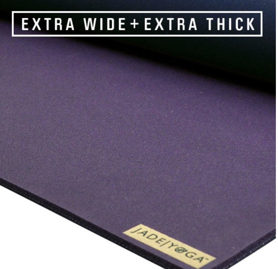 Close-up of a purple Jade/Yoga mat, highlighting its extra wide and thick features.
