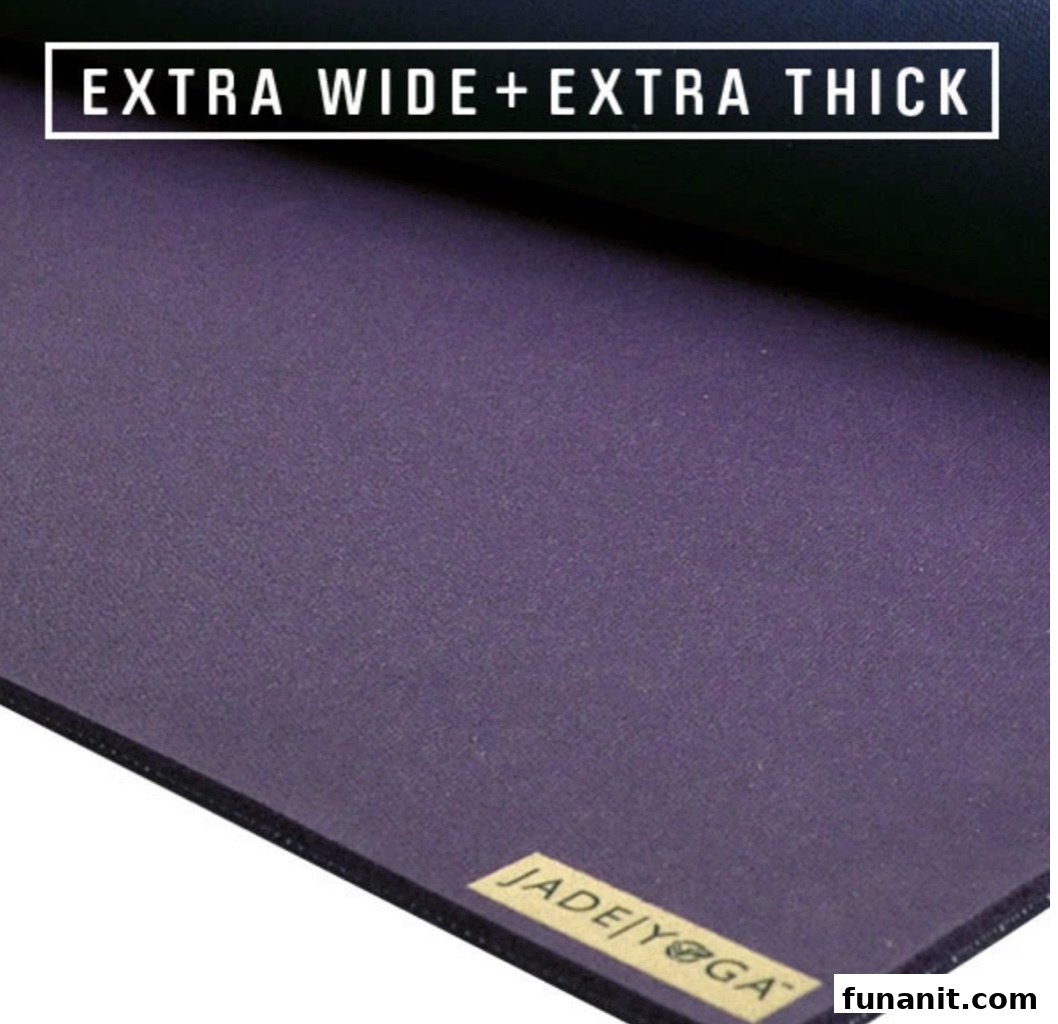 Close-up of a purple Jade/Yoga mat, highlighting its extra wide and thick features.