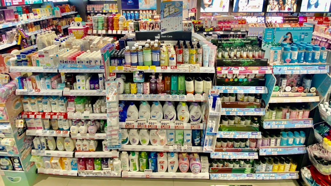 A wide array of health and beauty products displayed on shelves inside a Watsons store.