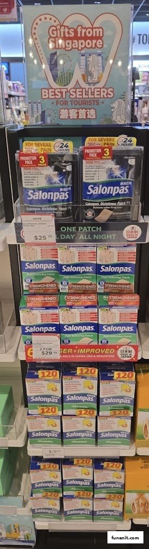 A retail display featuring various Salonpas pain relief products and a 'Gifts from Singapore' sign.
