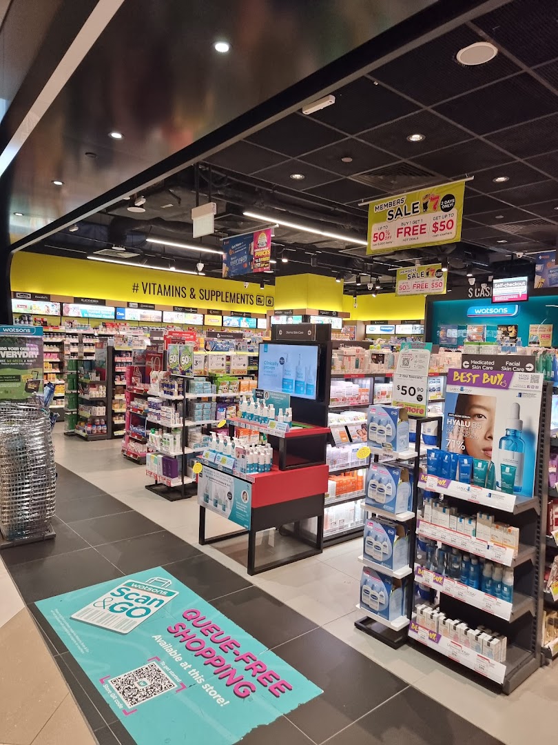 An interior view of Watsons, showcasing health, beauty, and supplement aisles with ongoing sales and a Scan & Go option.