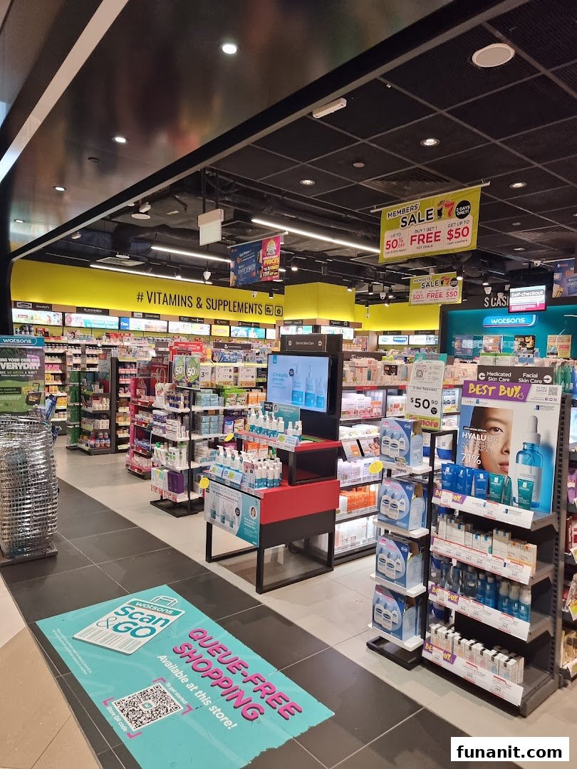 An interior view of Watsons, showcasing health, beauty, and supplement aisles with ongoing sales and a Scan & Go option.