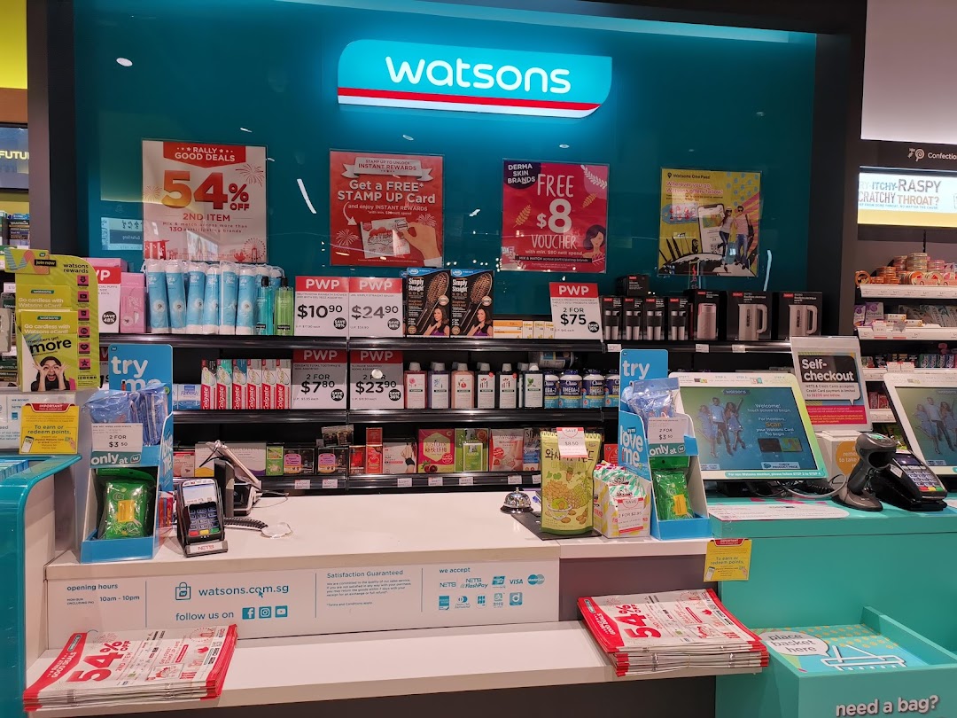 Interior view of a Watsons store, showcasing health and beauty products, promotional displays, and a self-checkout area.