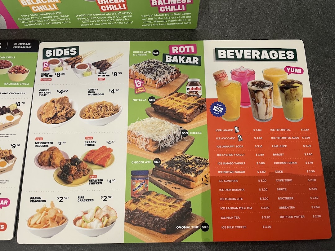 A detailed menu board displaying a variety of sides, Roti Bakar, and beverages with prices.