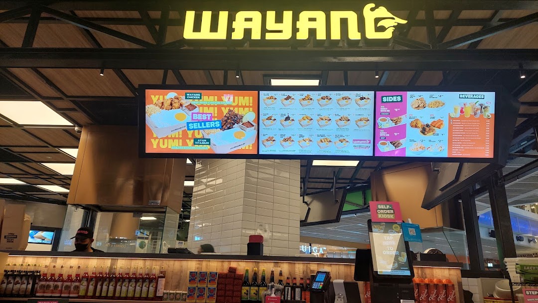 Digital menu boards display a variety of Indonesian-inspired dishes, sides, and beverages at Wayang Funan.