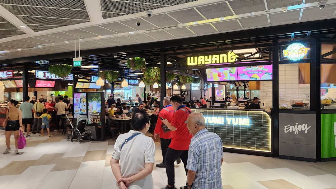 A vibrant food court scene at Funan, featuring Wayang and other diverse food stalls with many patrons.
