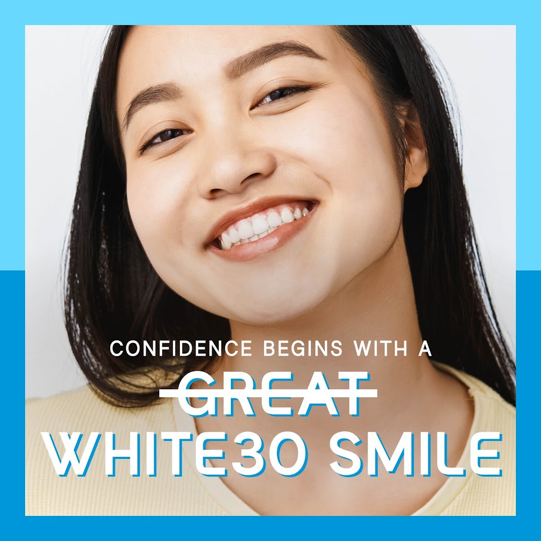 A smiling woman with bright teeth and promotional text about White30 teeth whitening.