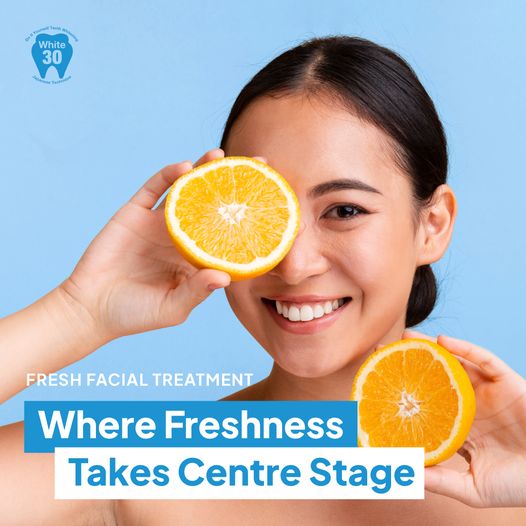 A smiling woman holds orange halves, promoting fresh facial treatments with White30 branding.