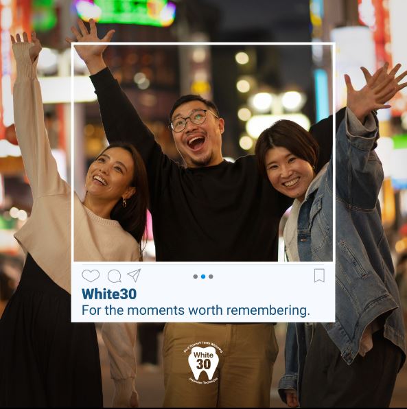 Three happy people celebrating, framed by a social media post featuring the White30 teeth whitening logo.