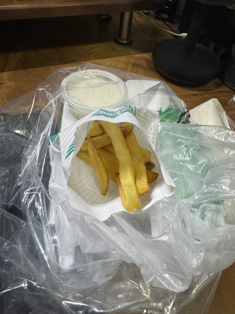 Crispy golden fries and creamy dipping sauce from Wingstop, ready to enjoy.