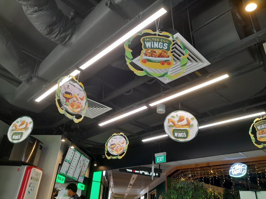 Interior view of Wingstop Funan featuring promotional signs for their popular Salted Egg Wings.