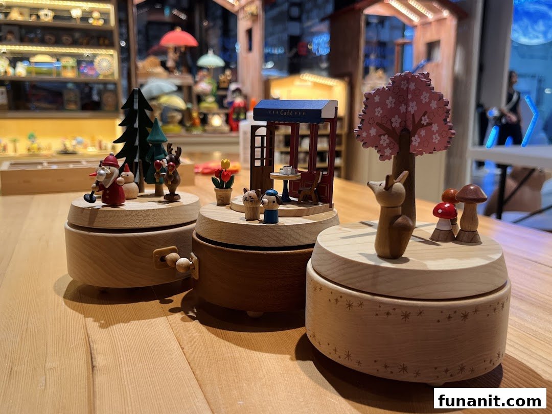 Close-up of charming wooden music boxes and figurines displayed inside Wooderful Life Singapore.