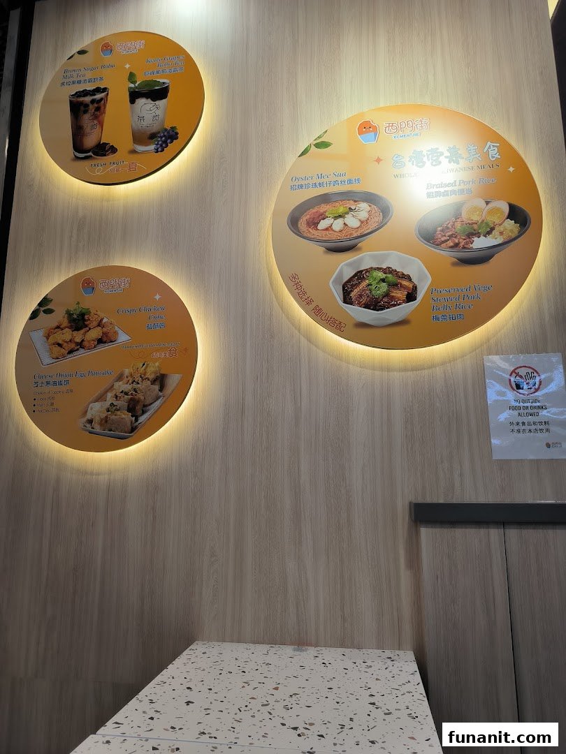 Illuminated circular display boards showcasing Taiwanese main dishes, snacks, and beverages.